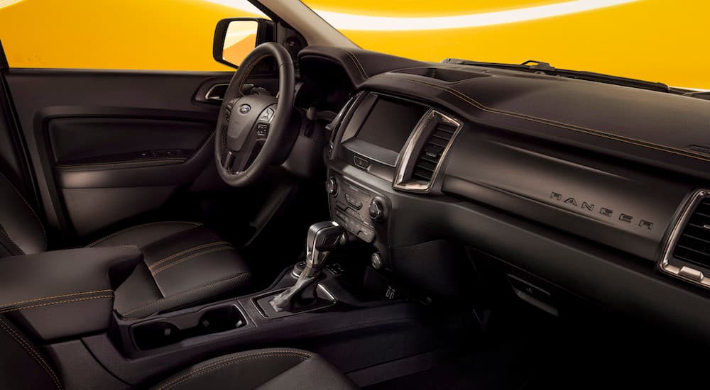 The black interior of a 2023 Ford Ranger Splash is shown from the passenger seat.