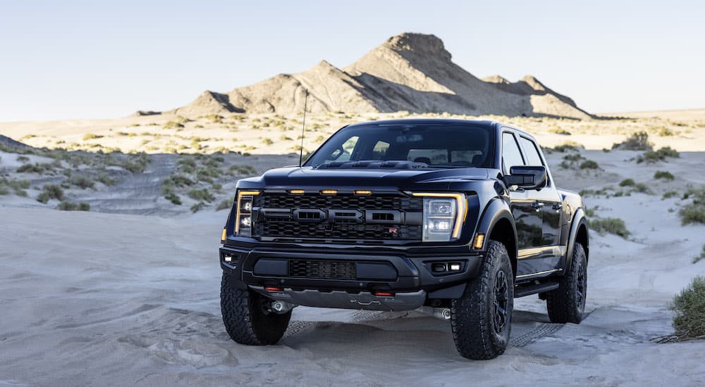 A black 2023 Ford F-150 Raptor R is shown from the front at an angle.