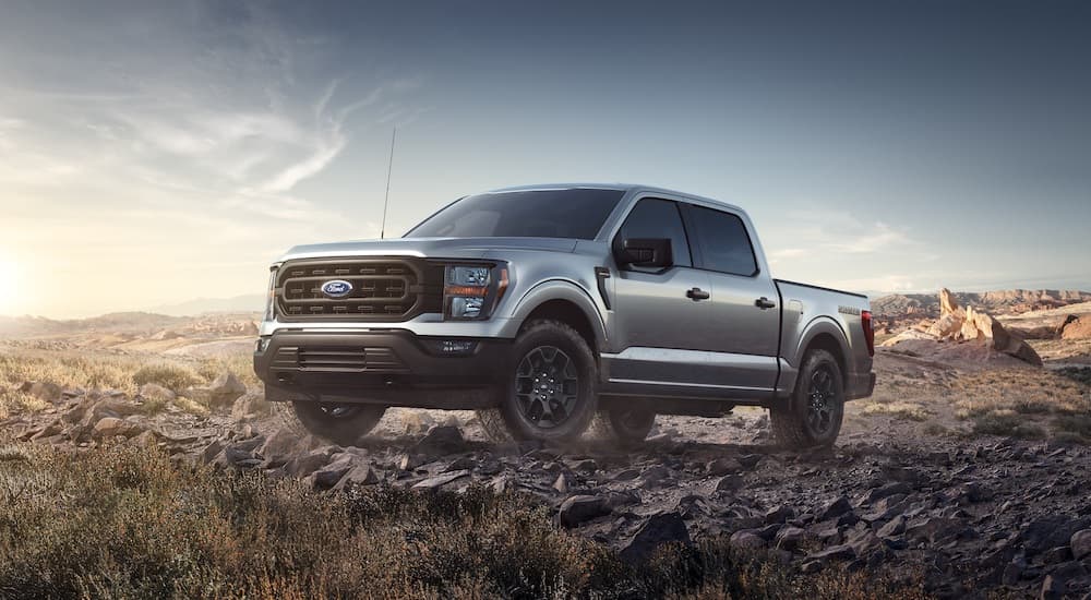 A silver 2023 Ford F-150 Rattler is shown from the front at an angle.