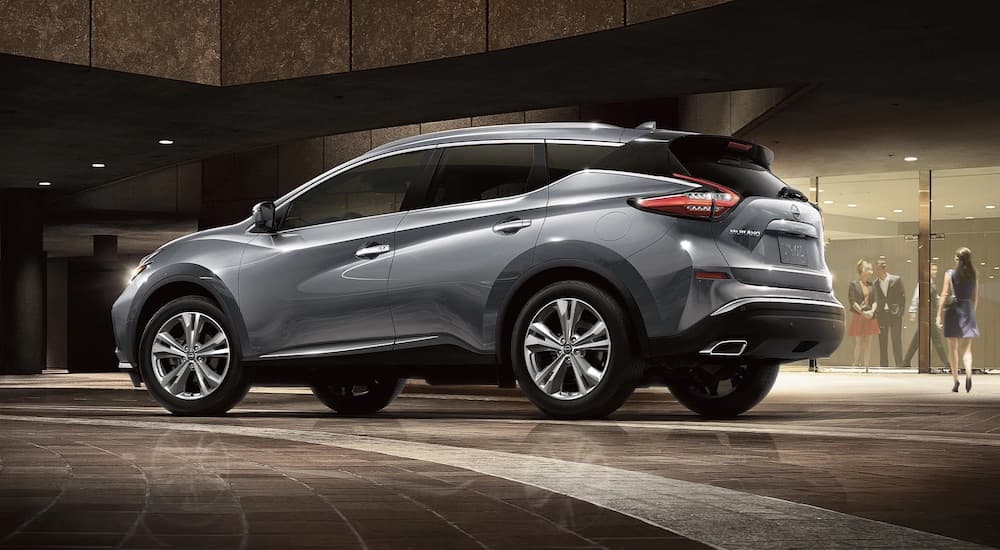 A grey 2023 Nissan Murano is shown from the side.