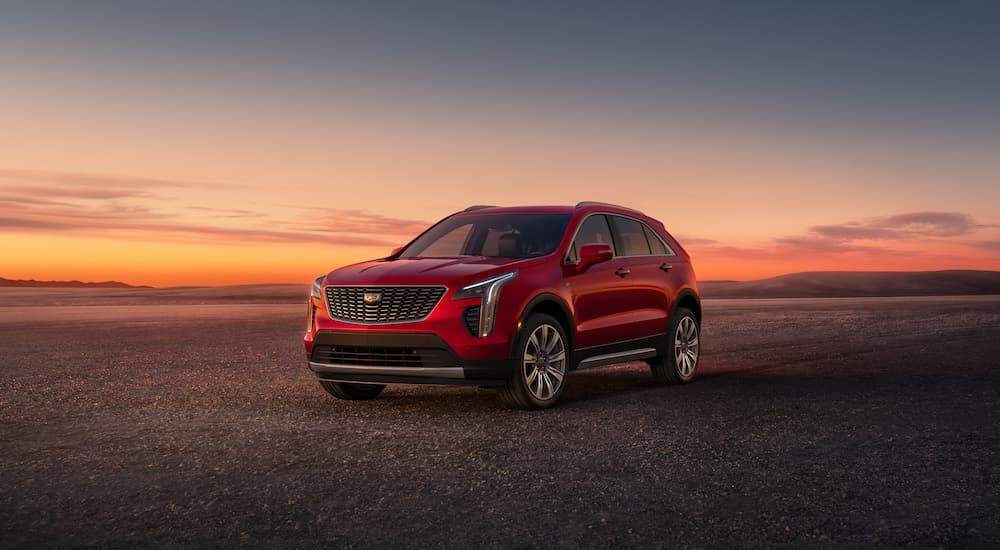 A red 2023 Cadillac XT4 is shown from the front at an angle.