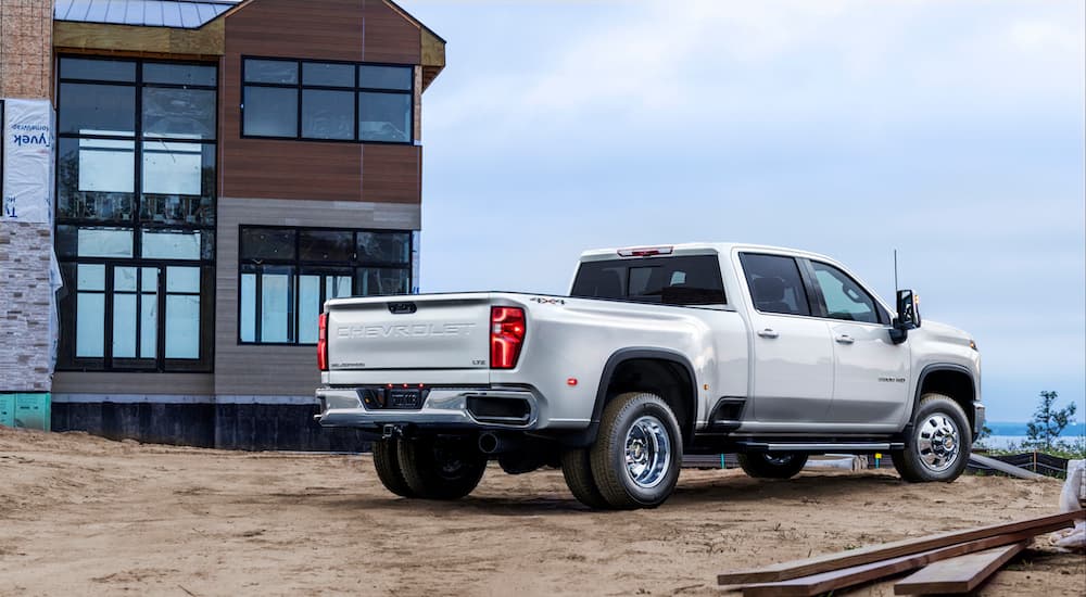 A white 2024 Chevy Silverado 3500 HD LTZ is shown from the rear at an angle.