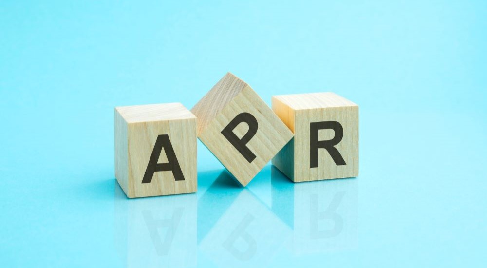 Blocks that that spell APR are shown against a blue background.