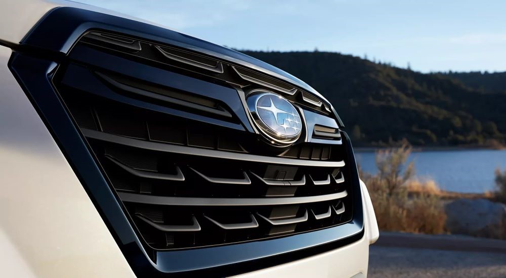 A close up shows the grille and badge on a 2023 Subaru Forester for sale.