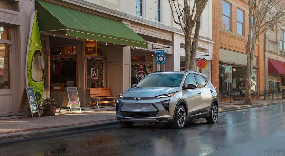 A silver 2022 Chevy Bolt EUV is shown parked on the side of a city street.