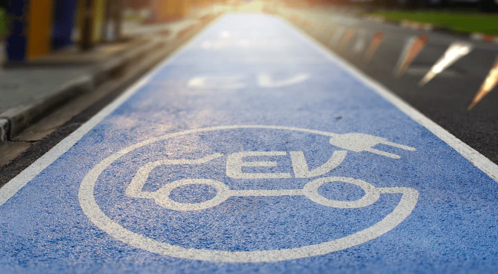 A close up of an EV parking space is shown.