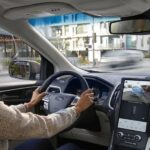 A woman is shown using the Rear View Camera in a 2023 Ford Edge.