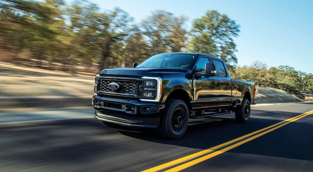 A black 2023 Ford F-250 XL STX is shown from the front at an angle.