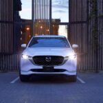 A white 2023 Mazda CX-5 is shown from the front after winning a 2023 Mazda CX-5 vs 2023 Hyundai Tucson comparison.