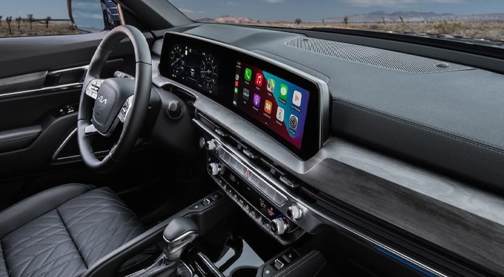 The black interior and dash of a 2023 Kia Telluride is shown.