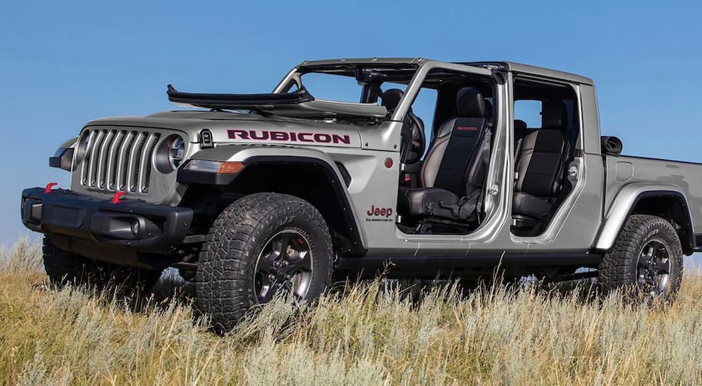 A silver 2023 Jeep Gladiator Rubicon is shown from the side at an angle.