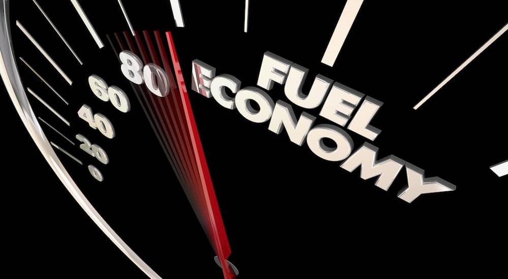 A fuel economy speedometer is shown. 
