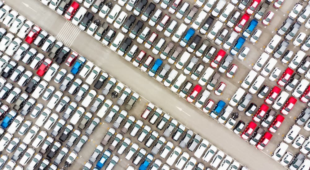 Vehicles are shown on a used Chevy dealer sales lot.