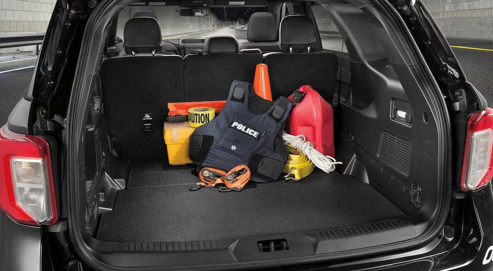 The cargo area of a 2023 Ford Explorer Police Interceptor Utility is shown loaded with police gear.