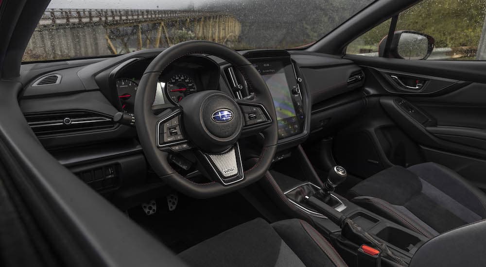 The interior and dash of a 2022 Subaru WRX is shown.