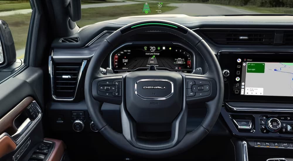 The driver's view of a 2023 GMC Sierra 1500 Denali is shown using Super Cruise.