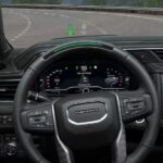 The driver's view of a 2023 GMC Yukon Denali is shown using Super Cruise.