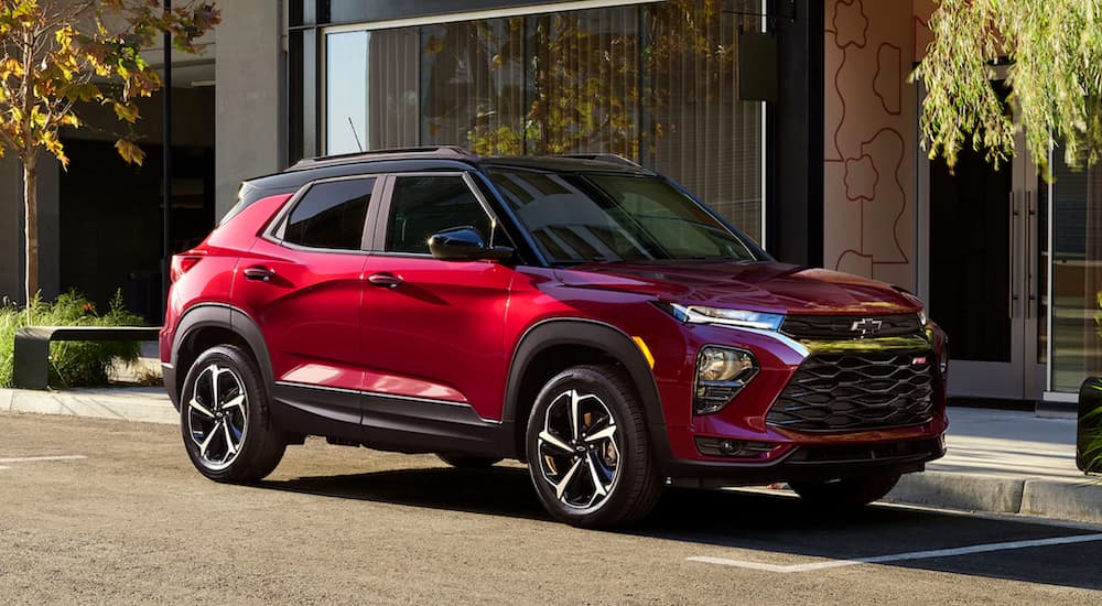 A red 2021 Chevy Trailblazer is shown parked after visiting a used GM dealer.