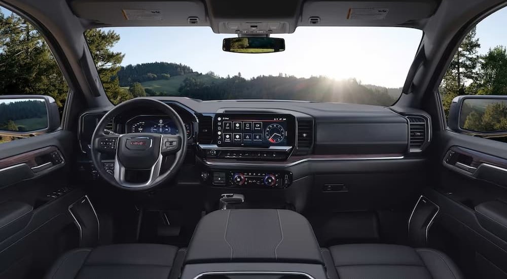 The black interior and dash of a 2023 GMC Sierra 1500 is shown.