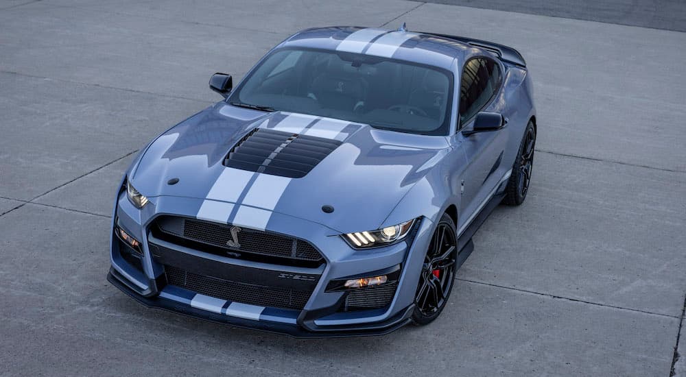 A grey 2022 Ford Mustang Shelby GT500 is shown from the front at an angle after leaving a Ford dealer.