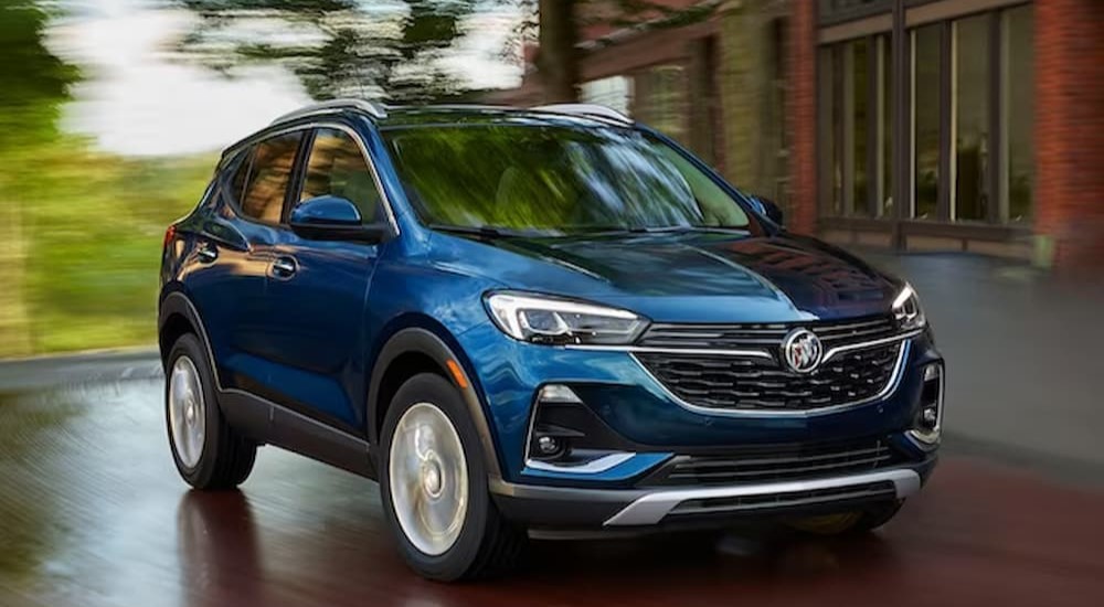 A blue 2023 Buick Encore GX is shown driving after winning a 2023 Buick Encore GX vs 2023 Honda HR-V comparison.