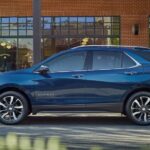 A blue 2023 Chevy Equinox is shown from the side after winning a 2023 Chevy Equinox vs 2023 Toyota RAV4 comparison.