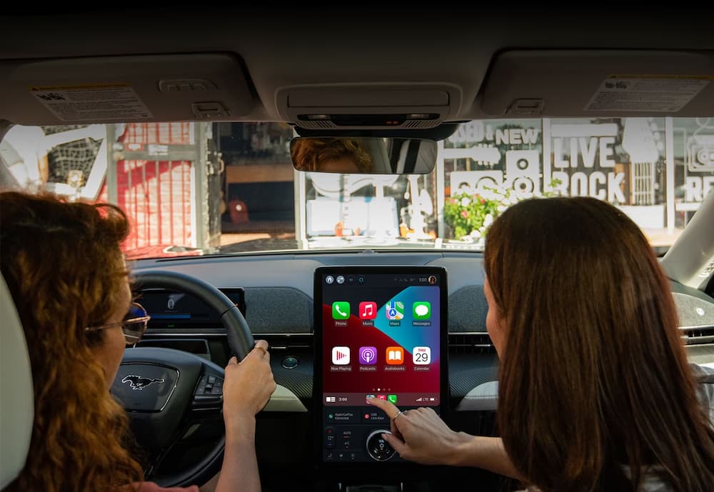 The black interior and dash of a 2023 Ford Mustang Mach-E is shown.