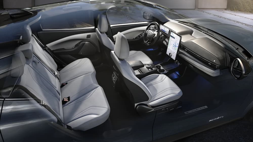 The white and black interior and dash of a 2023 Ford Mustang Mach-E is shown.