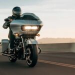 A 2023 Harley-Davidson Road Glide Special is shown driving on a highway.