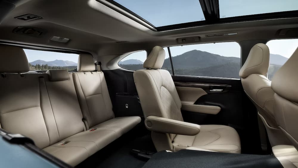 The tan interior of a 2023 Toyota Highlander is shown.