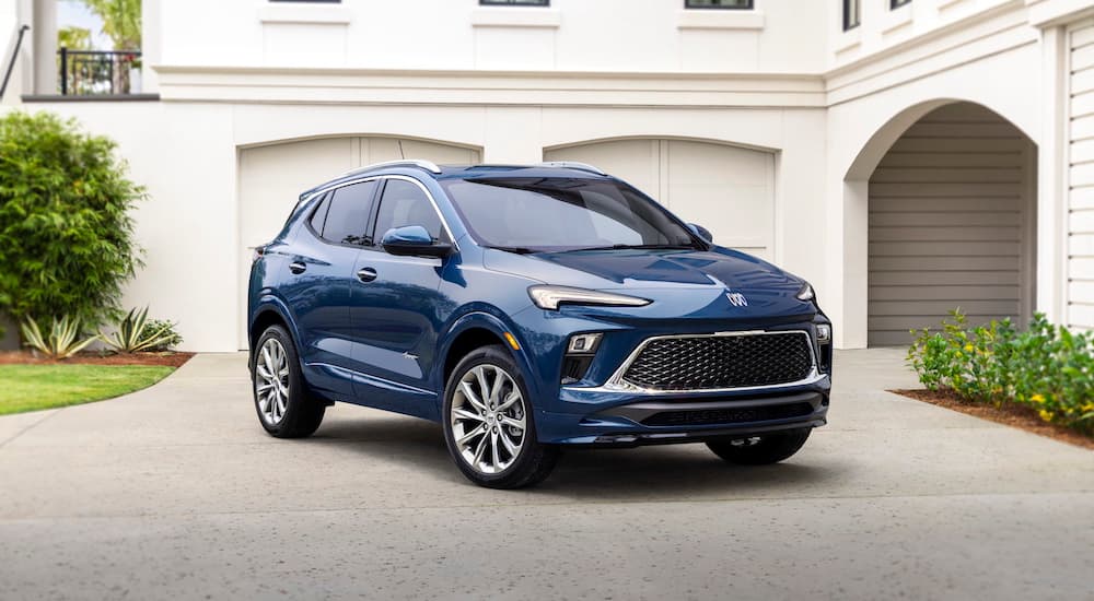 A blue 2024 Buick Encore Avenir is shown from the front at an angle.