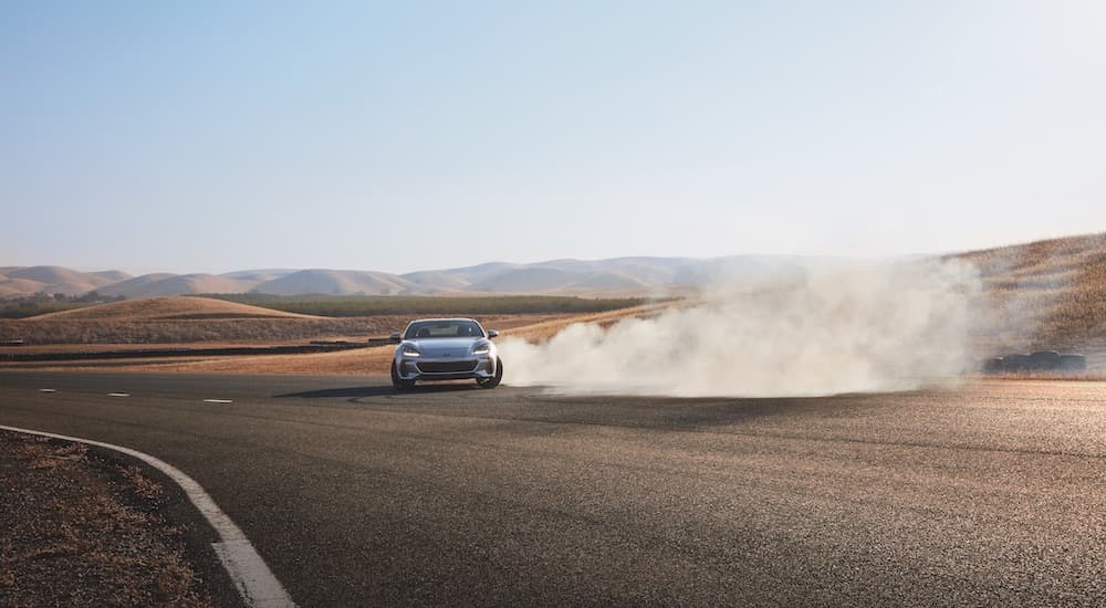 A silver 2022 Subaru BRZ is shown from the front while drifting.