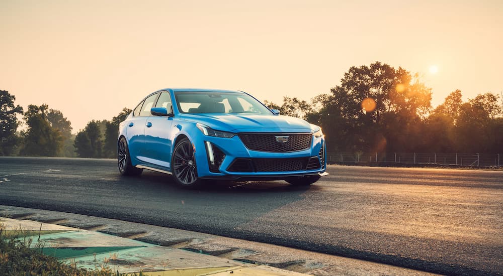 A 2023 Cadillac CT5 V Blackwing is shown driving on a road.