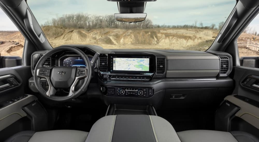 The gray interior and dash of a 2024 Chevy Silverado 2500 HD ZR2 is shown.