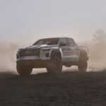 A white 2024 Chevy Colorado ZR2 Bison is shown parked off-road.