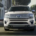 A white 2021 Ford Expedition is shown from the front after leaving a dealer that has a Ford Expedition for sale.