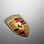 A Porsche logo is shown.