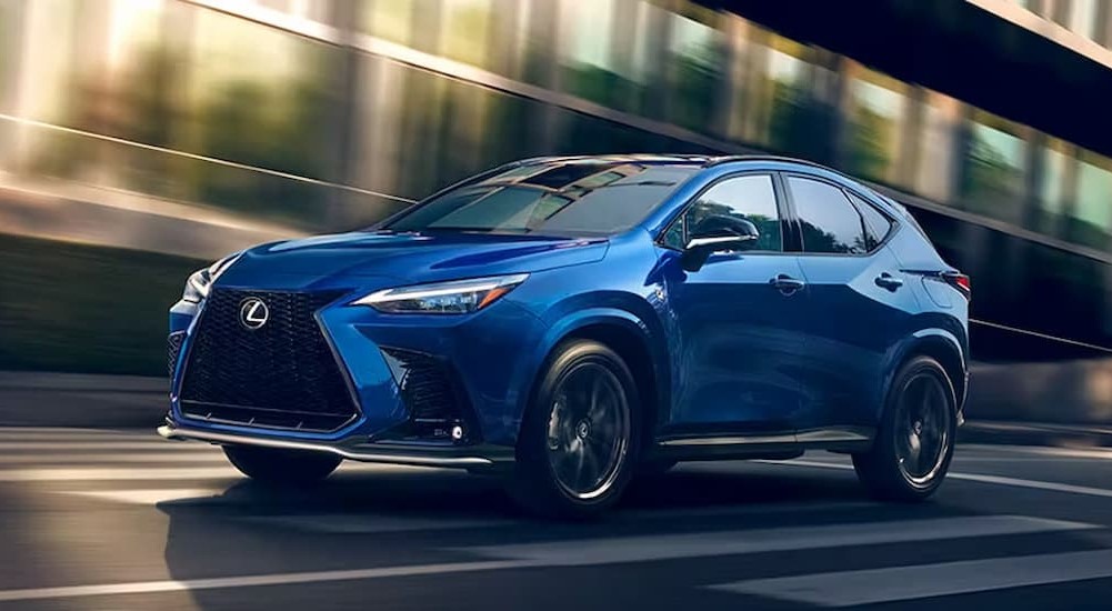 A blue 2023 Lexus NX is shown driving on a street.