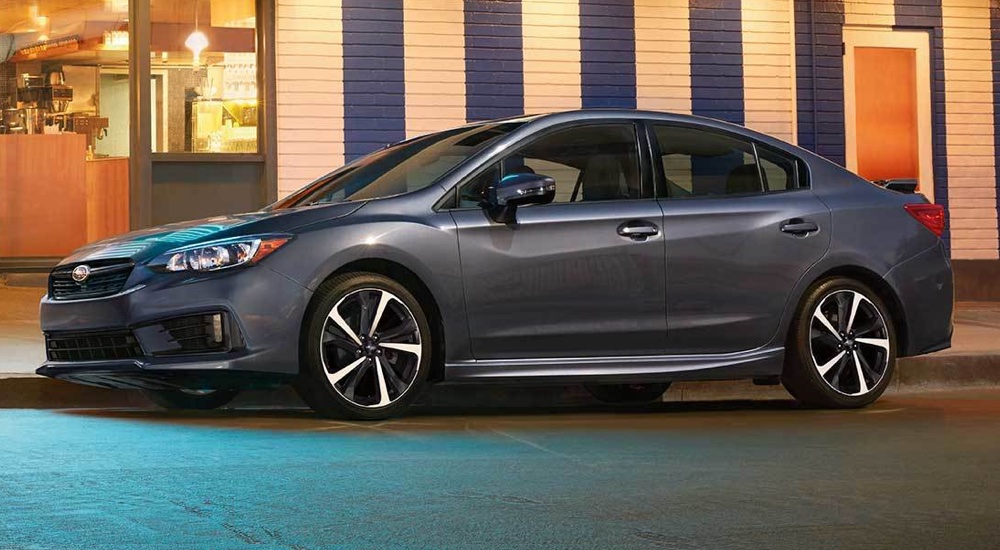 A gray 2022 Subaru Impreza Sport is shown parked on a street.