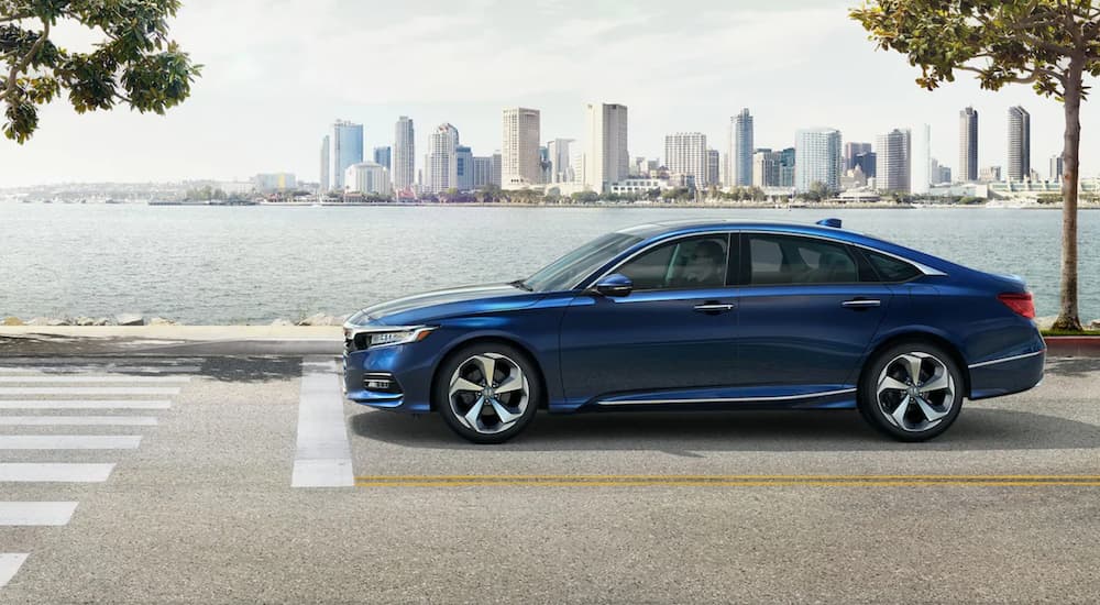 A dark blue 2020 Honda Accord is shown parked near a crosswalk.