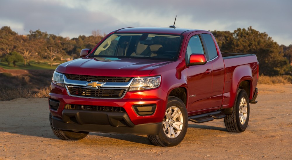 A red 2017 Chevy Colorado is shown parked on dirt.