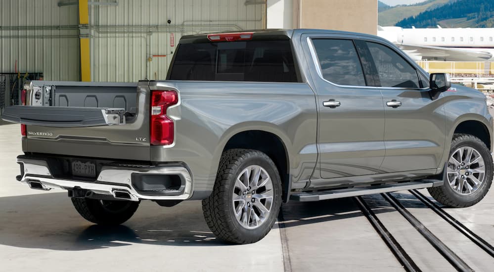 The rear of a silver 2021 Chevy Silverado 1500 LTZ is shown.