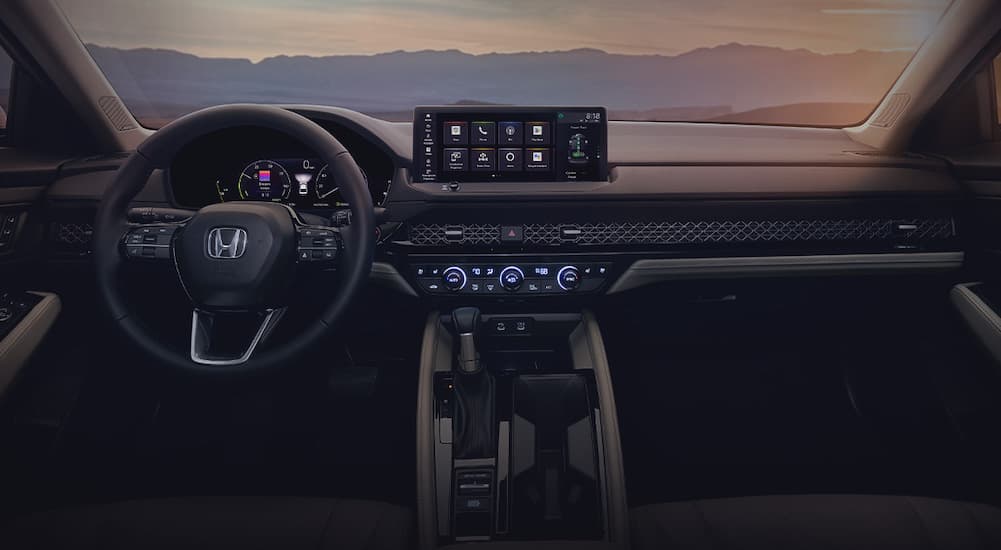 The black and gray interior and dash of a 2023 Honda Accord is shown.