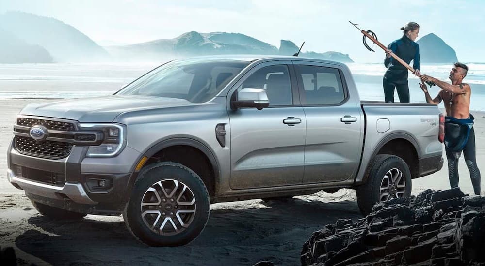 A silver 2024 Ford Ranger Sport 4x4 is shown parked near an ocean.