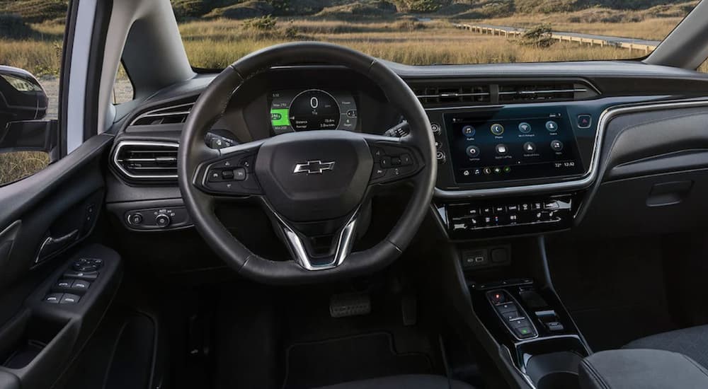 The black interior and dash of a 2023 Chevy Bolt EV is shown.