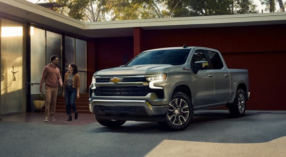 A silver 2023 Chevy Silverado 1500 Z71 is shown parked on a driveway.