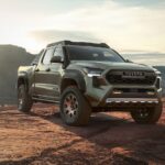 A green 2024 Toyota Tacoma is shown parked off-road.