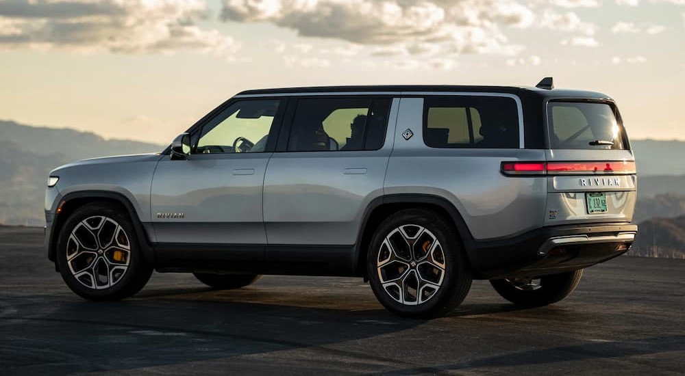 A silver 2023 Rivian R1S is shown parked outdoors.