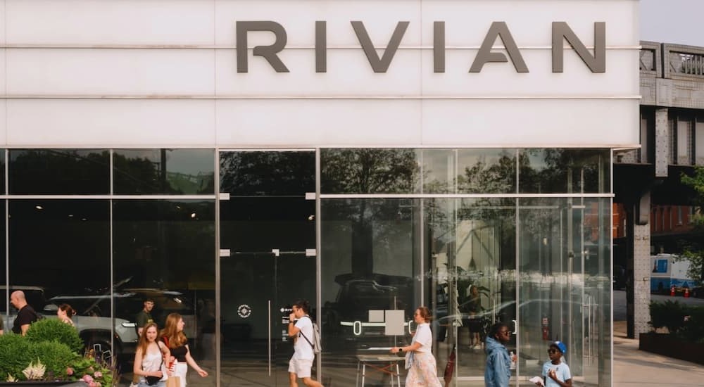In current auto news, a Rivian showroom is shown.