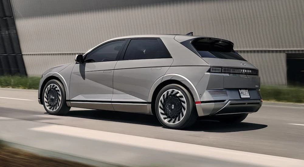 A gray 2022 Hyundai Ioniq 5 is shown driving on a road.